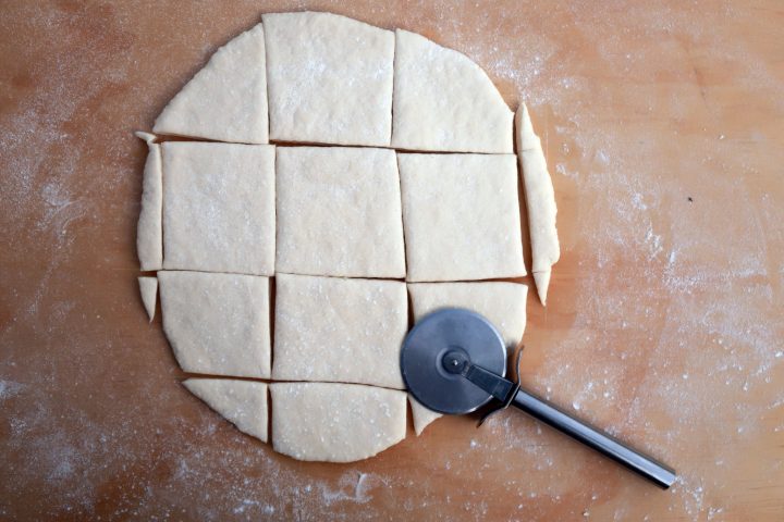 hardtack dough rolled out and cut into irregular rectangles with a pizza cutter