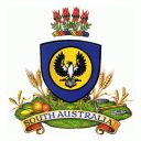 The piping shrike appears on a shield in the centre of the arms. Above is a crest of 4 springs of Sturt's desert pea mounted on a wreath of red, blue and gold. The arms is atop a grassy mound, on which stand grape vines, stalks of wheat and barley, citrus fruits, two cog wheels and a miners pick. Below is a scroll bearing the name South Australia.