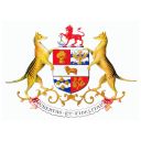 A shield bears a branch of hops, a sheath of wheat, a ram, apples and a thunderbolt. The shield is supported by two Tasmanian tigers. Atop is a crest on which a red lion holds a pick and shovel.